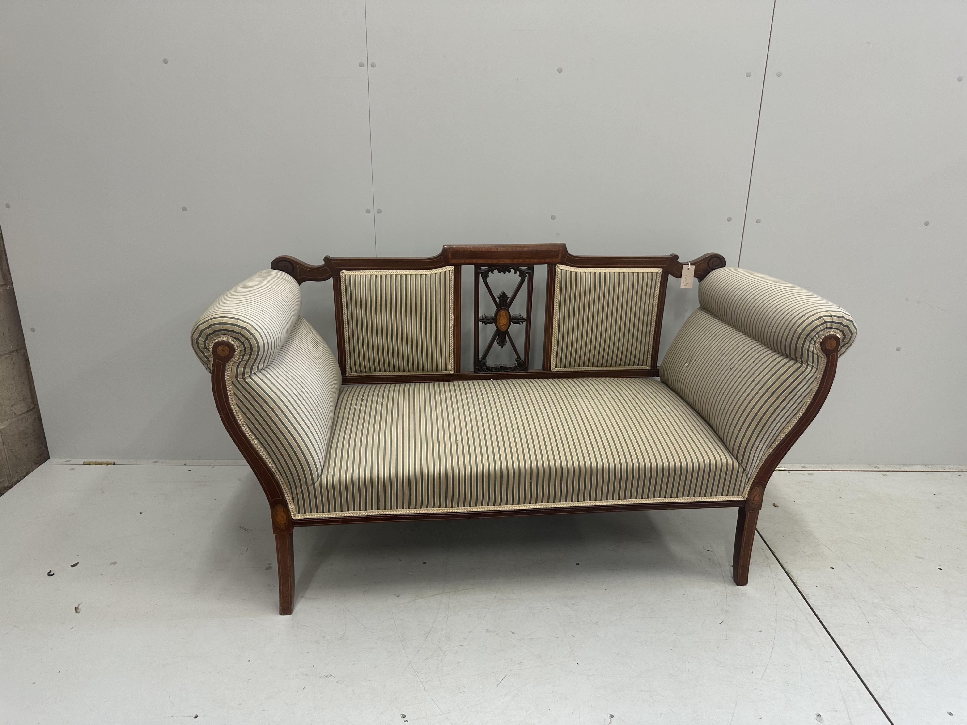 An Edwardian inlaid mahogany settee, width 150cm, depth 60cm, height 84cm. Condition - fair